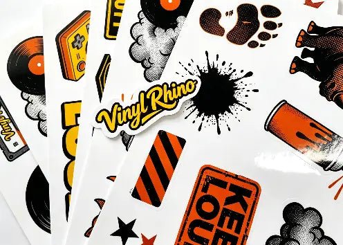 Professional custom kiss-cut sticker sheets featuring multiple unique designs on a single vinyl page, perfect for branding, artists, and promotional giveaways by Vinyl Rhino.

