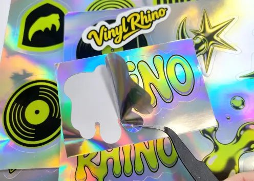 High-quality holographic logo decals with a shimmering metallic finish, designed to make business branding stand out on product packaging and promotional merchandise.