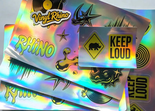 Custom holographic stickers featuring a striking rainbow shiny effect that adds a premium, eye-catching visual impact to your brand designs.